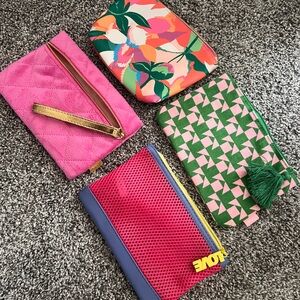 Make-up pouches, set of four. Multi-color as shown, zipper, new.